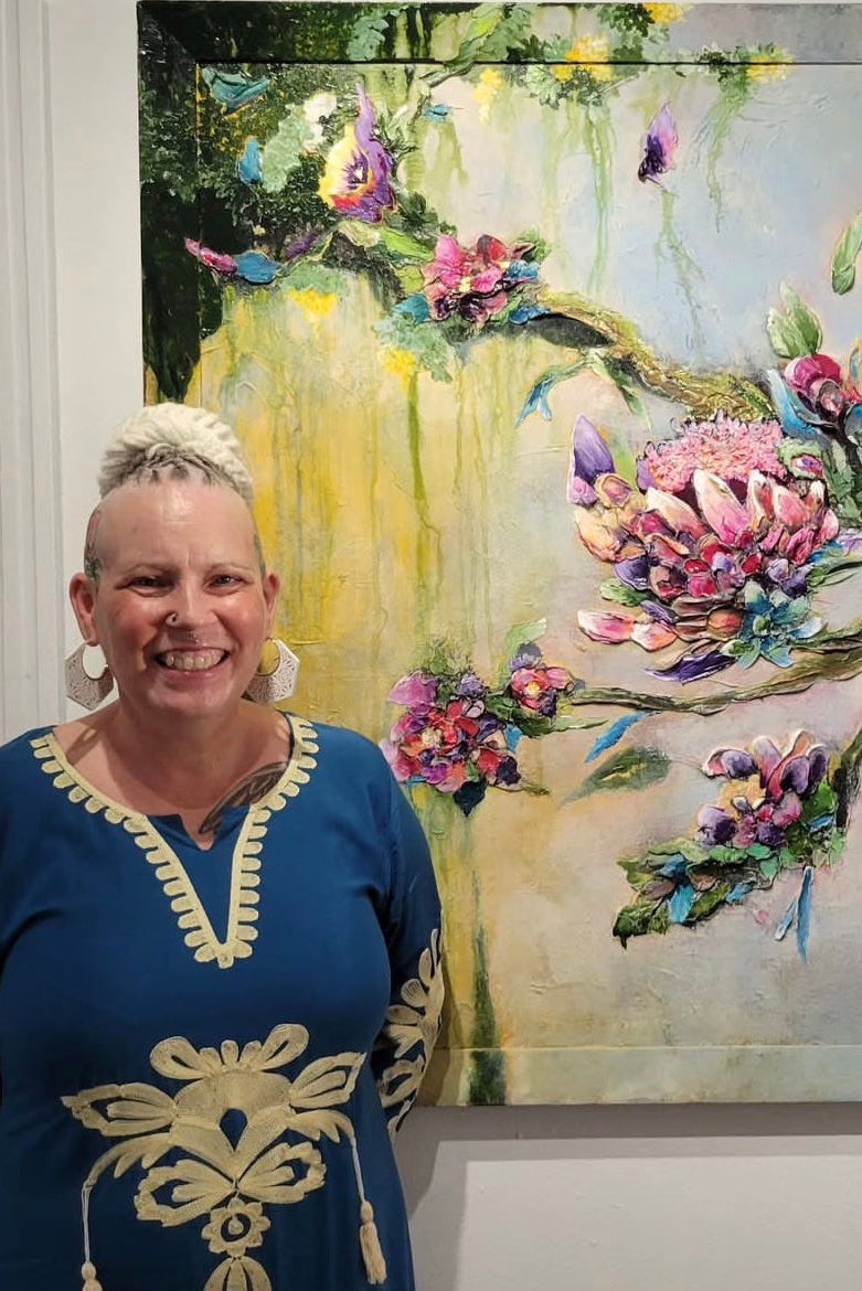 Ziva Sanchez standing in front of her artwork in CMC Arts Gallery in Frederiksted, St. Croix, U.S. Virgin Islands